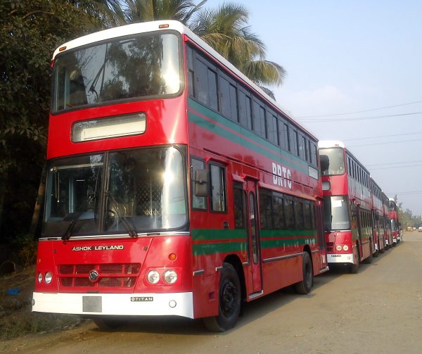 Several buses drive in a row