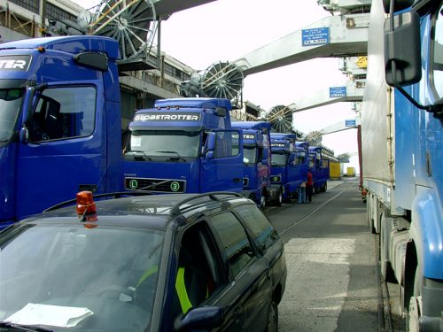 Several trucks in a row on a ship